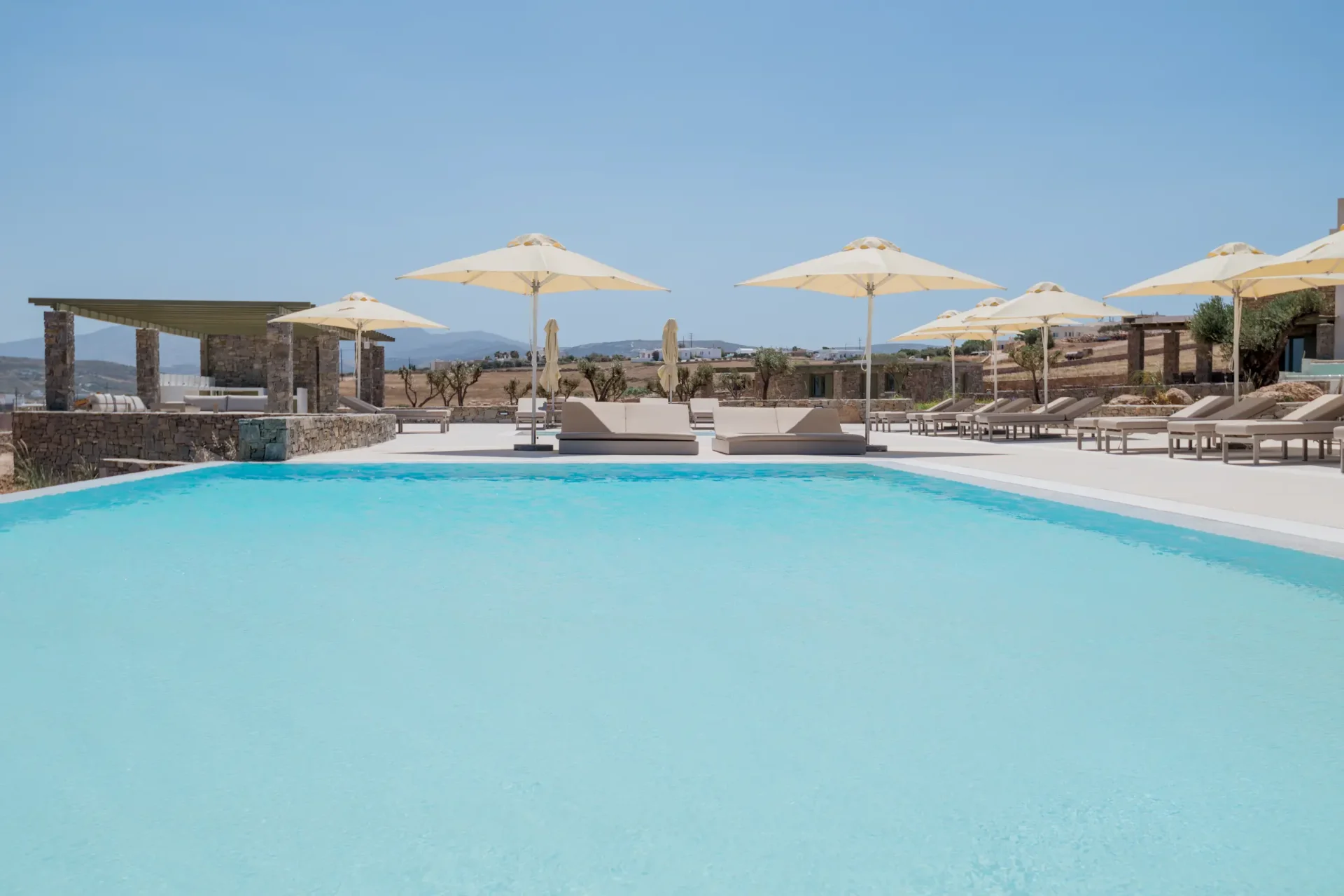 White Cliff Villas pool with umbrellas